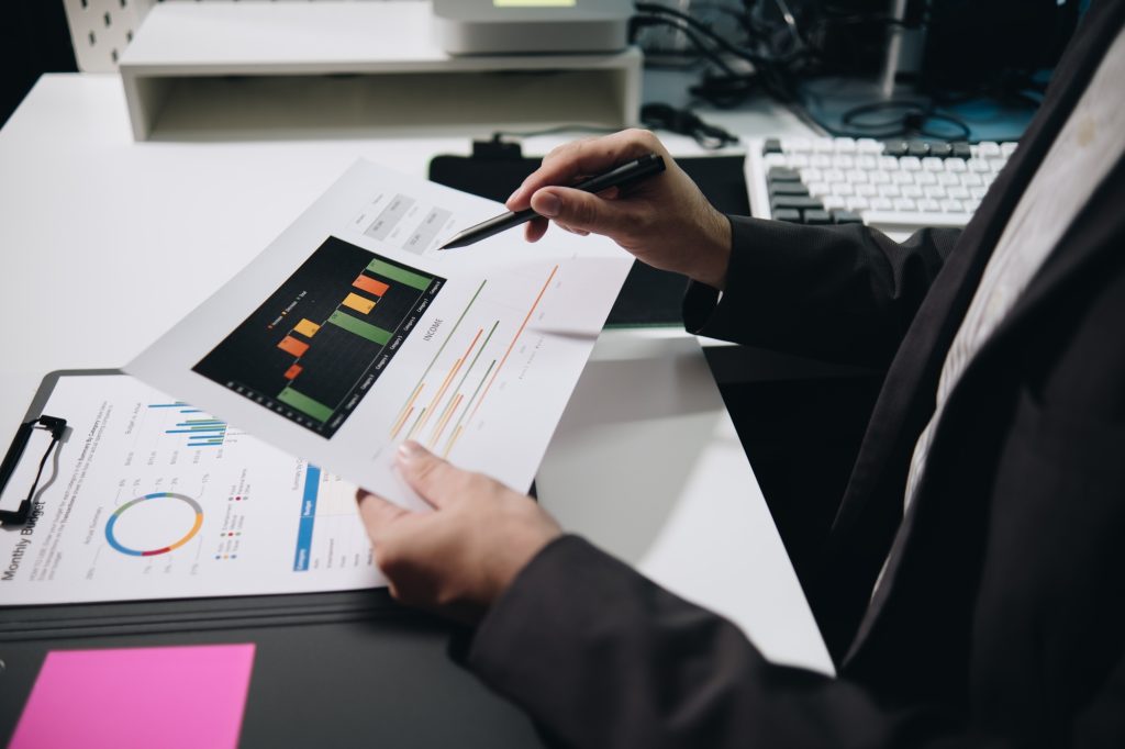 Businessman accountant working audit and calculating expense financial annual financial report