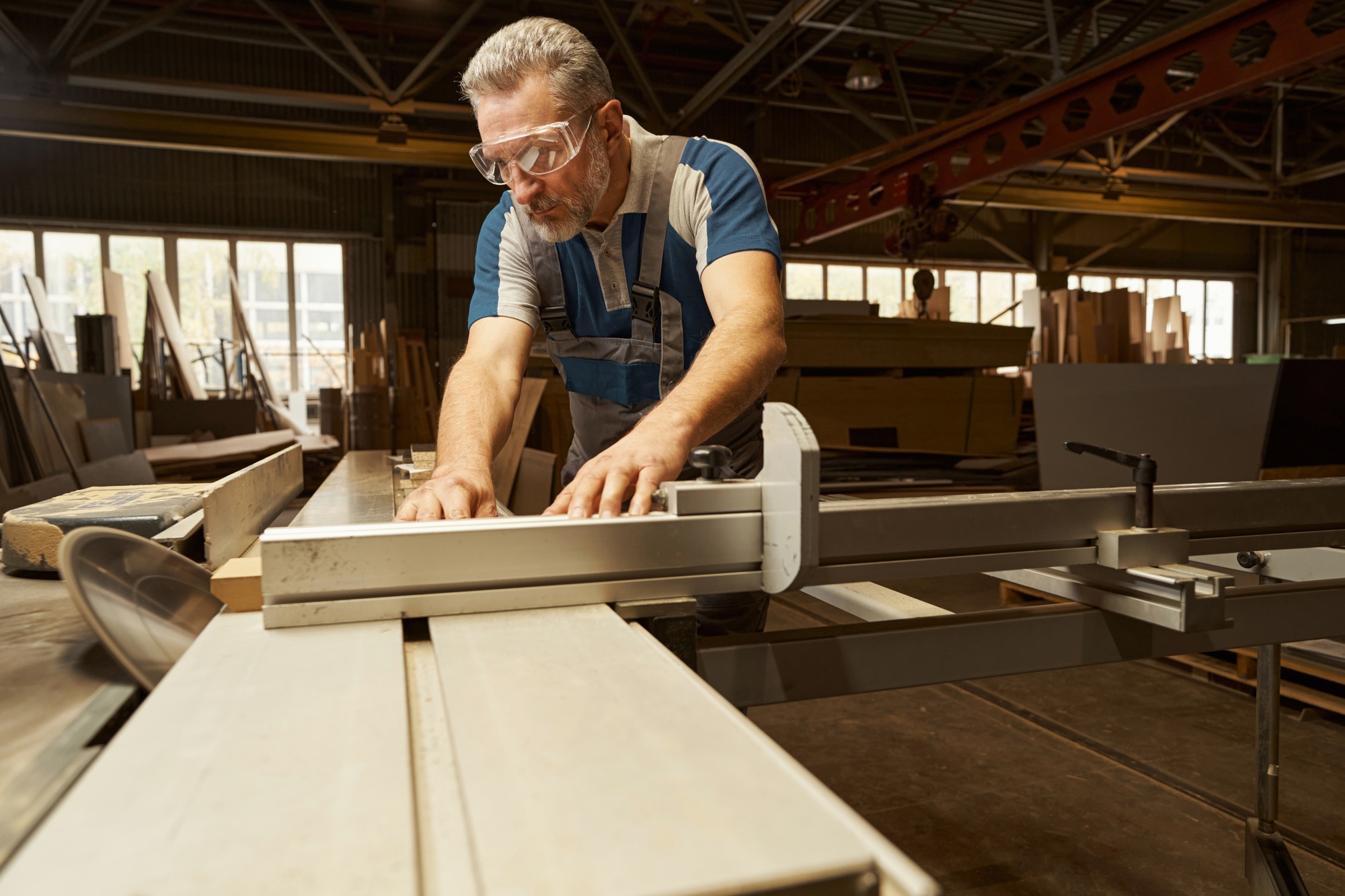 Close up of attentive joiner preparing wooden detail