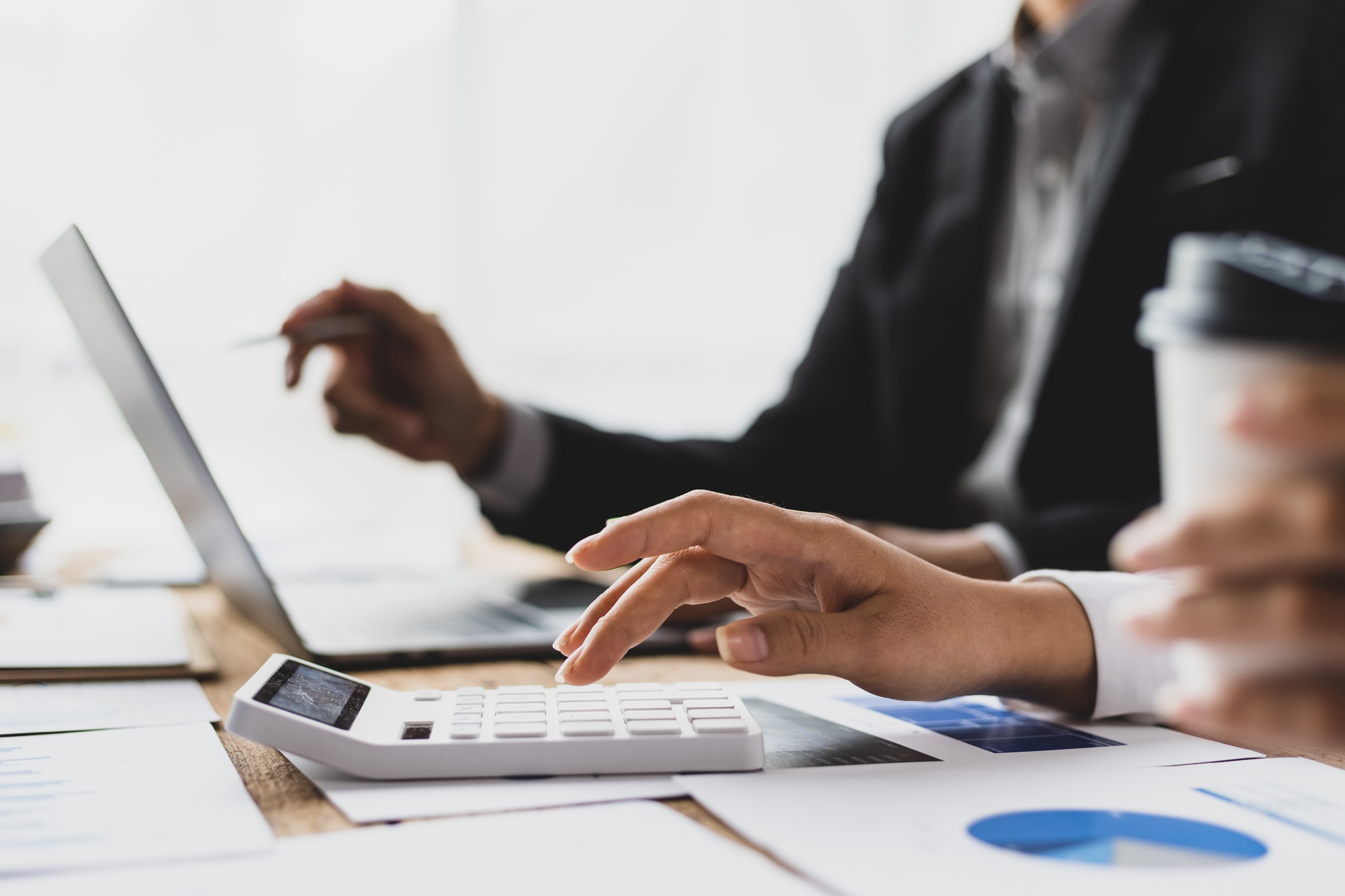 Financial advisor meeting is discussing the analysis of financial reports and business auditing.